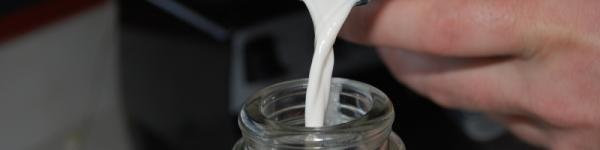 nut milk pouring into a jar