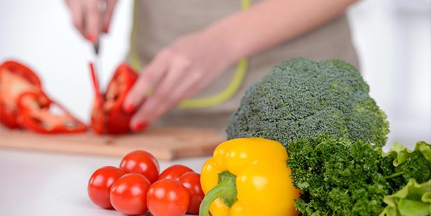 Cutting veggies for vegan diet plan